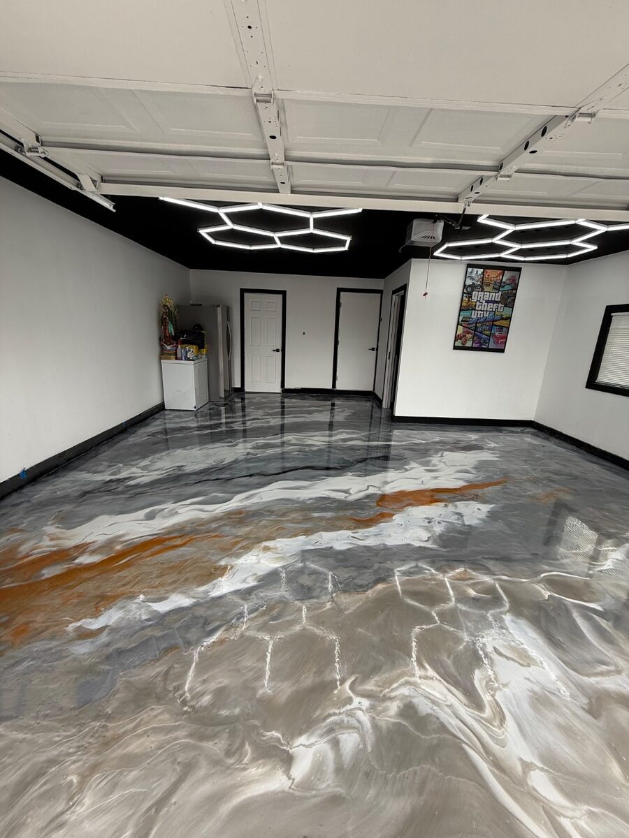 Blue and black metallic epoxy garage floor coating with hexagon LED lighting