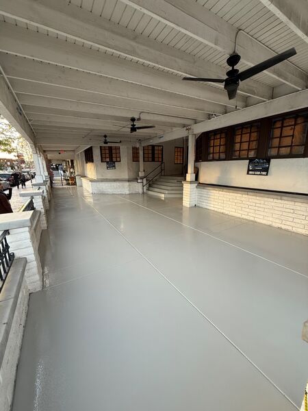Gray flake coated covered outdoor patio walkway