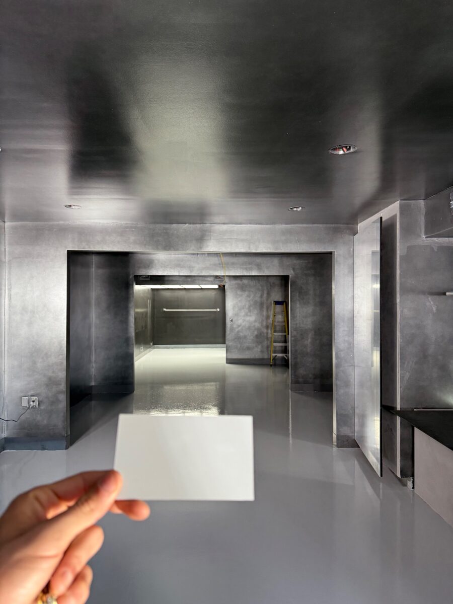 Polished gray metallic epoxy floor in a commercial hallway installed by Primo Epoxy Flooring